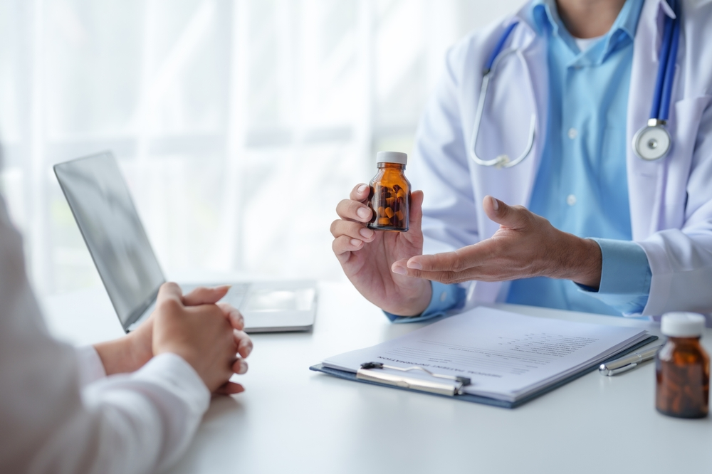 doctor explains medication to patient